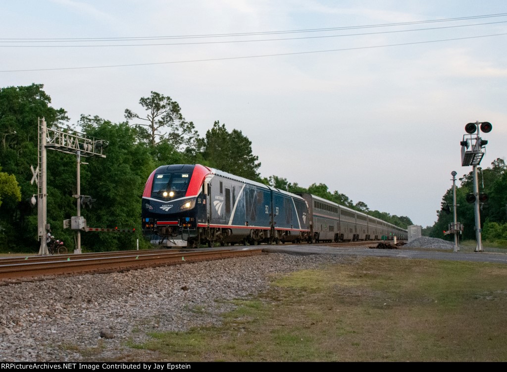The northbound Auto Train speeds across Martin Street 